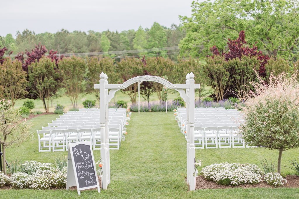 wedding ceremony in the rain at flora corner farm photographed by costola photography