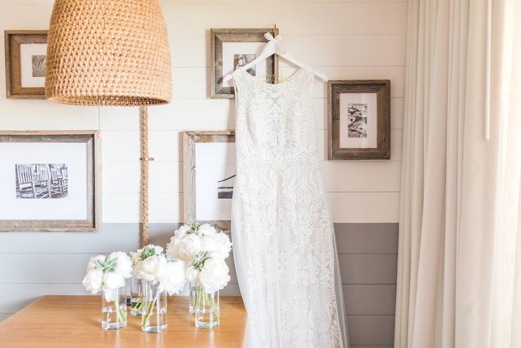 Wedding Dress hanging in the Beach House Resort by Costola photography
