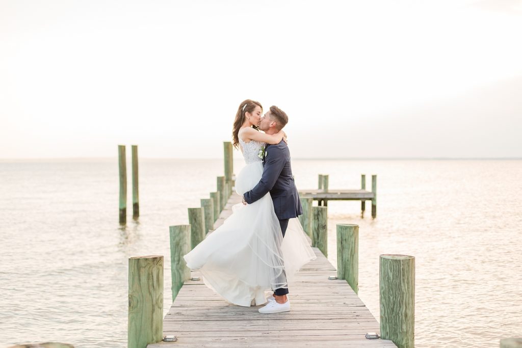 sunset bride and groom portraits at waterfront wedding venue in southern maryland by costola photography