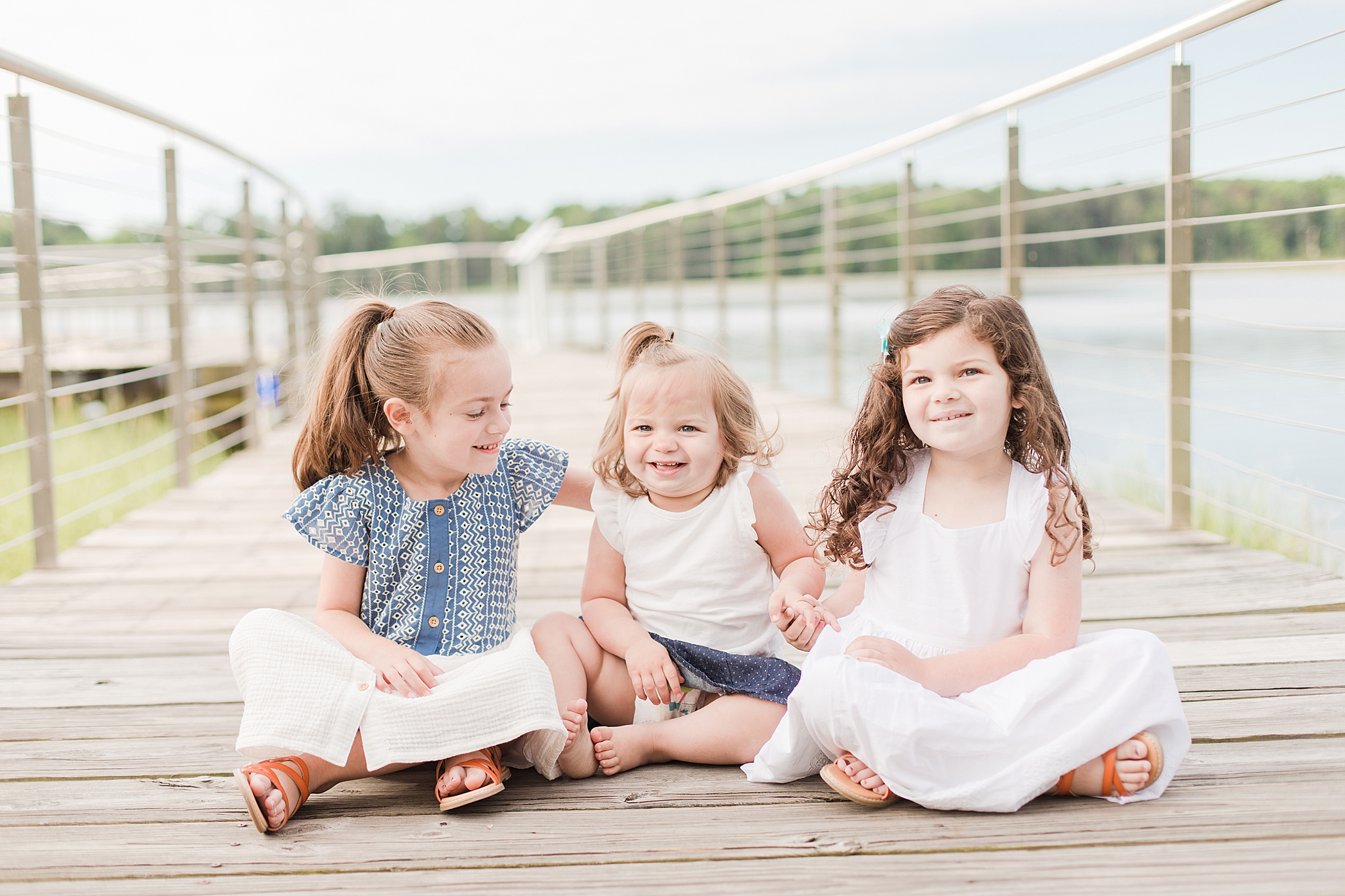 Three little girls at Leonardtown Wharf by Costola Photography