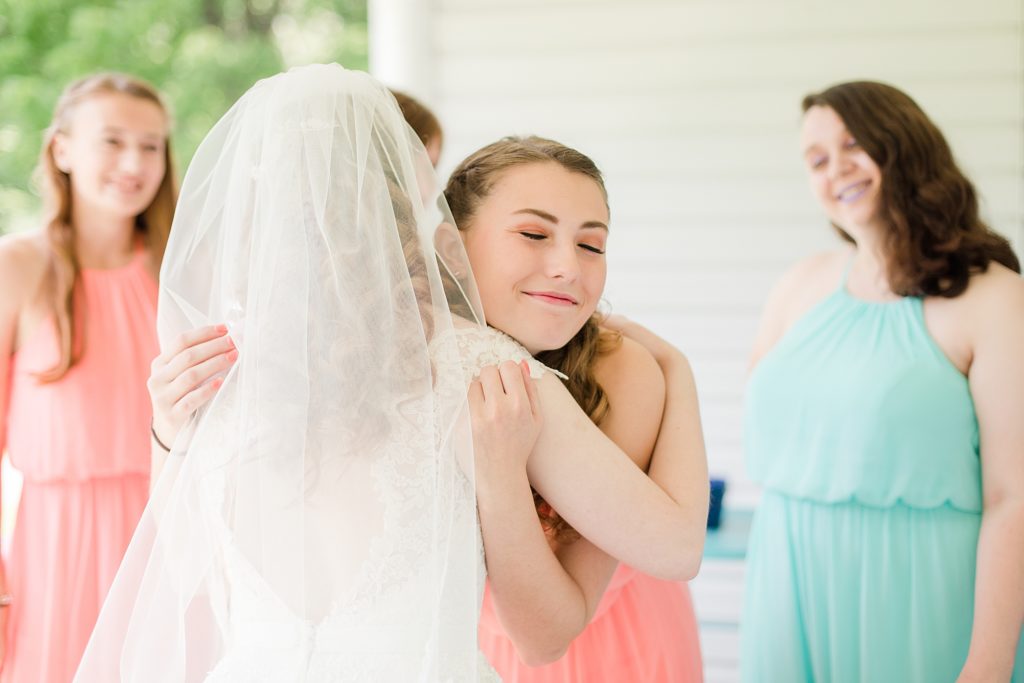 bridesmaids seeing bride for the first time by Costola Photography
