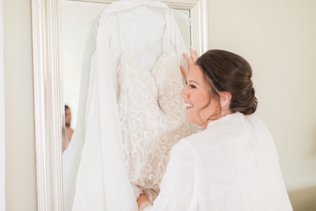 bride getting ready at waterfront weatherly farm wedding by Costola Photography
