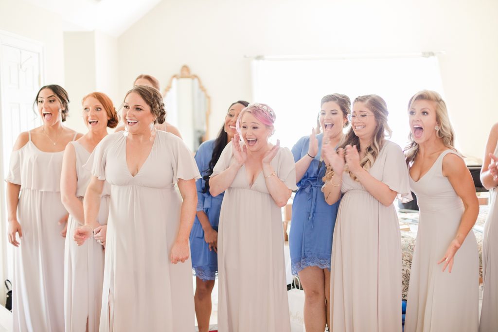 bridesmaids seeing bride for first time at waterfront weatherly farm wedding by Costola Photography