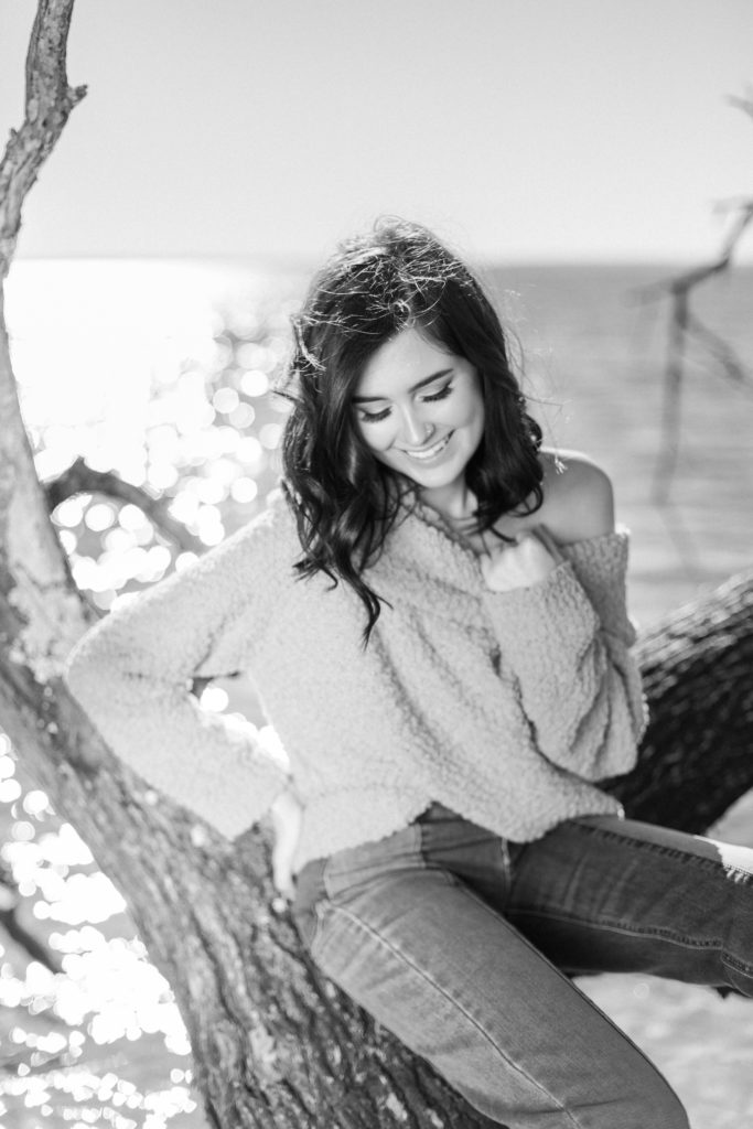 La Plata High School Senior Girl Laughing in pink sweater by Costola Photography