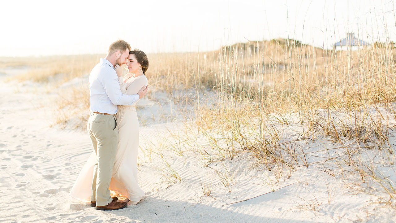 Couple on the beach at South End Wilmington North Carolina by Costola Photography
