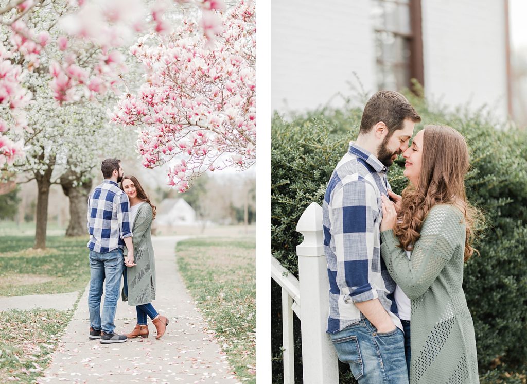 Couple standing under cherry blossom blooms in southern maryland for engagement session by Costola Photography