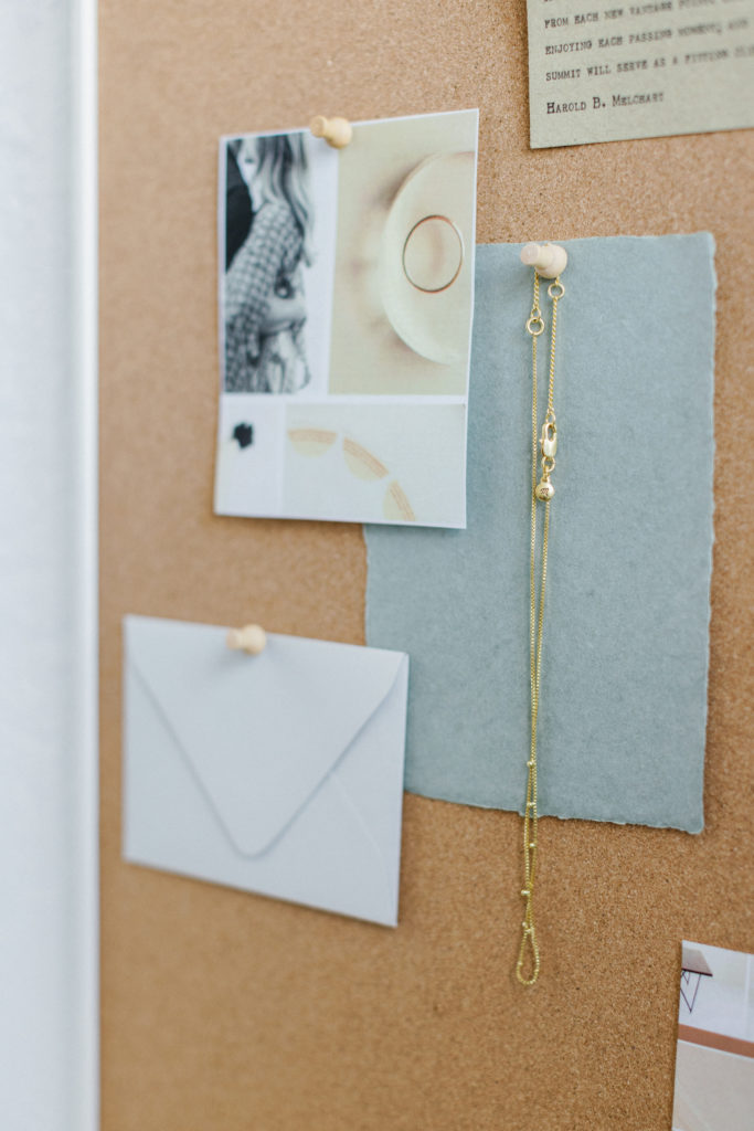 pinned ideas on cork board for your personal brand photoshoot